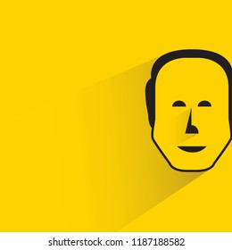 human face with shadow in yellow background