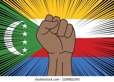 Human fist clenched symbol on flag of Comoros background. Power and strength logo
