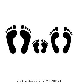 Human footprint. Black silhouette of man, woman and baby footprints. Family. Vector icons isolated on white background.