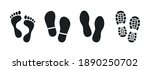 Human footprints. Bare foot prints. Shoe soles print. Black traces of human. Step footprints. Shoe tread prints.