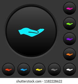 Human hand dark push buttons with vivid color icons on dark grey background