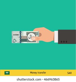 Human hand gives money vector illustration. Saudi Arabian riyal banknote.