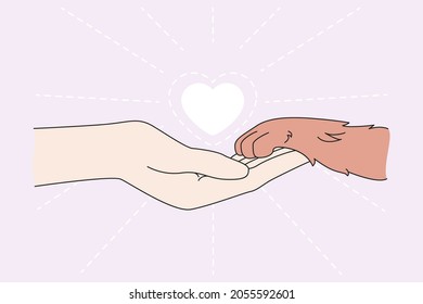 Human hand hold dog paw show care and love for animals. Person and pet friendship. People caring about puppies and cats. Flat vector illustration. Adoption and shelter, charity, volunteer concept. 