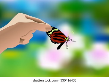 Human hand holding a butterfly on floral blurry background.