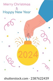 A human hand holding a Christmas ball, isolated on a white background, around there are serpentines and the inscription Merry Christmas and Happy New Year. Hand with New Year's toy, festive element. 