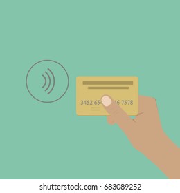 Human hand holding credit card.Mobile payment. Tap to pay