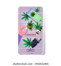 mano humana sosteniendo taza de té con hojas de cannabis medico consumo de drogas productos de marihuana en el fondo de madera pantalla de smartphone aplicación móvil top angle view copy space