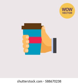 Human hand holding disposable cup