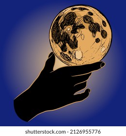 Human hand holding full moon in shining halo. Creative concept. 
