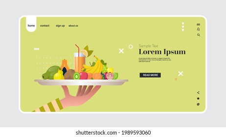 human hand holding glass with orange fruit juice healthy juicy vitamin drink sweet tropical fruits composition in white plate vegan food concept horizontal copy space
