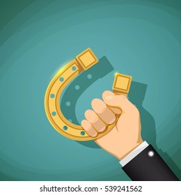 Human hand holding a gold horseshoe. Talisman for good luck. Stock vector illustration.