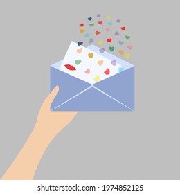 Human hand holding love letter. Envelope filled with little multi colored flying hearts and letter with lipstick kiss mark. Isolated vector illustration on grey background