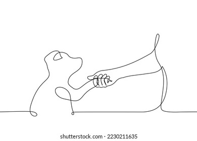 human hand holding paw of puppy looking at human - one line drawing vector. concept love for animals, a dog lover gets acquainted with a pet