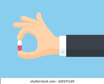 Human Hand Holding Pill Between Fingers Vector Illustration In Flat Style