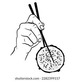 Human hand holding a round slice of Yellow Dragon Fruit with chopsticks. Pitaya or Pitahaya cactus. Selenicereus megalanthus. Exotic food design. Black and white silhouette.