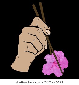 Human hand holding single flower of azalea or rhododendron with chopsticks. Funny vegan food design. On black background.