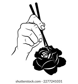 Human hand holding single rose flower with chopsticks. Funny vegan design. Devouring of beauty. Black and white silhouette.