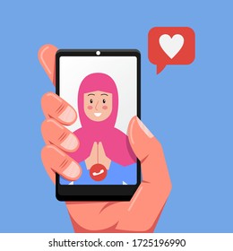 Human Hand Holding Smart Phone Online Video Call On The Screen With Muslim Hijab Girl. Close Friend Of Family Member During Eid Mubarak, COVID-19 Disease Outbreak Quarantine. Vector Illustration