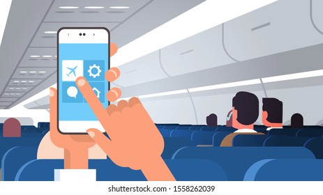 human hand holding smartphone with flight mode rules of airplane safety concept modern plane board with passengers horizontal flat vector illustration