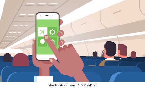 human hand holding smartphone with flight mode rules of airplane safety concept modern plane board with passengers horizontal flat vector illustration