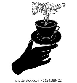 Mano humana sosteniendo una taza de té o café al vapor. El concepto de bebida creativa. Silueta blanca y negra.