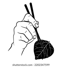 Human hand holding a tree leaf with chopsticks. Creative funny vegetarian food design. Black and white silhouette.
