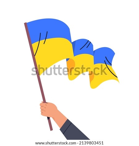 human hand holding Ukrainian flag pray for Ukraine peace save Ukraine from russia stop war concept