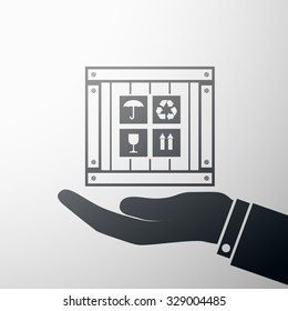 Human hand holding a wooden box. Stock vector illustration.