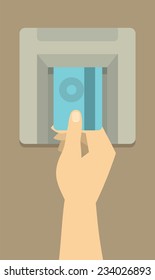 human hand inserts credit card at an ATM to get money