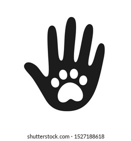 Human hand palm with dog or cat paw print symbol. Veterinary pet care, shelter adoption or animal charity logo design element. Helping hand vector illustration.