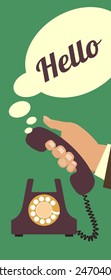 Human hand picks up the phone to answer the call