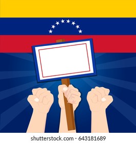 Human hand protesters holding the white placard Protesting the Venezuela government