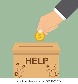 Human hand putting golden coin with dollar sign into donation paper cardboard box. Donate and help pets