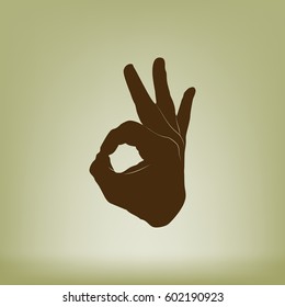 Human hand, showing OK sight, fingers showing symbol of a great state. OK icon
