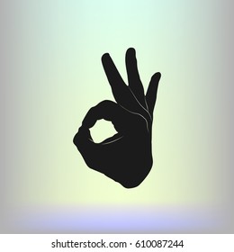 Human hand, showing OK sight, fingers showing symbol of a great state. OK icon