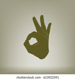 Human hand, showing OK sight, fingers showing symbol of a great state. OK icon
