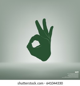 Human hand, showing OK sight, fingers showing symbol of a great state. OK icon
