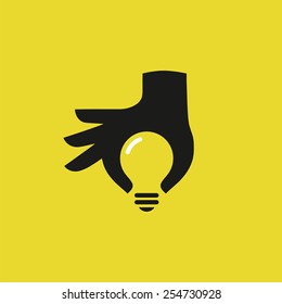 Human hand silhouette with idea light bulb. Concept design, vector illustration.