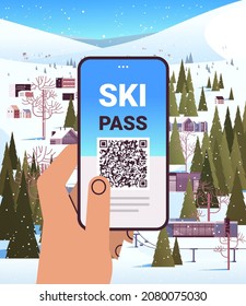 human hand using ski pass application on smartphone screen winter vacation concept snowy mountains landscape