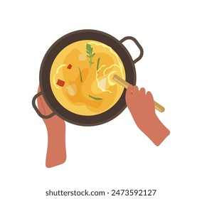 Human hands cooking cream soup in kitchen pot view from above isolated on white background