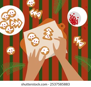 Human hands decorate Christmas gingerbread cookies