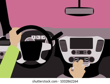 Human hands driving a car