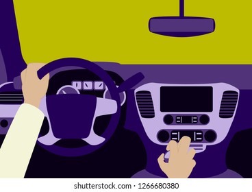 Human hands driving a car