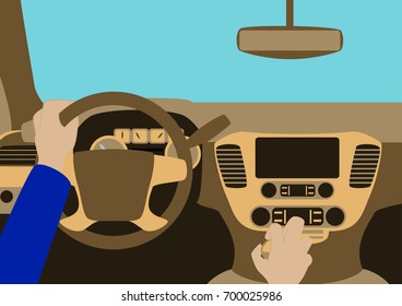 Human hands driving a car