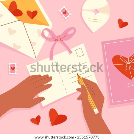 Human hands fill a Valentine's Day greeting card view from above
