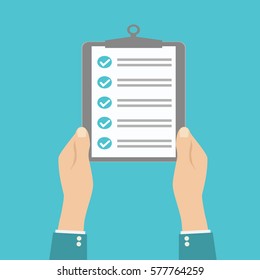 Human hands hold clipboard