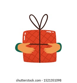 Human hands hold red gift box wrapped and decorated with bow isolated on white background. Festive concept of merry Christmas, happy new year, birthday.  