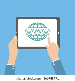 human hands hold tablet with web icon