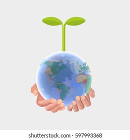 Human hands holding globe with sprout