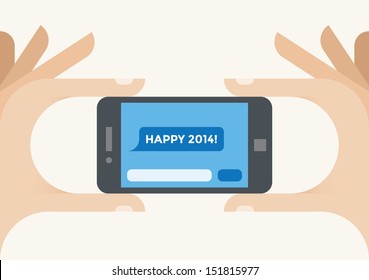 Human hands holding mobile phone with "Happy 2014!" SMS message on the screen.